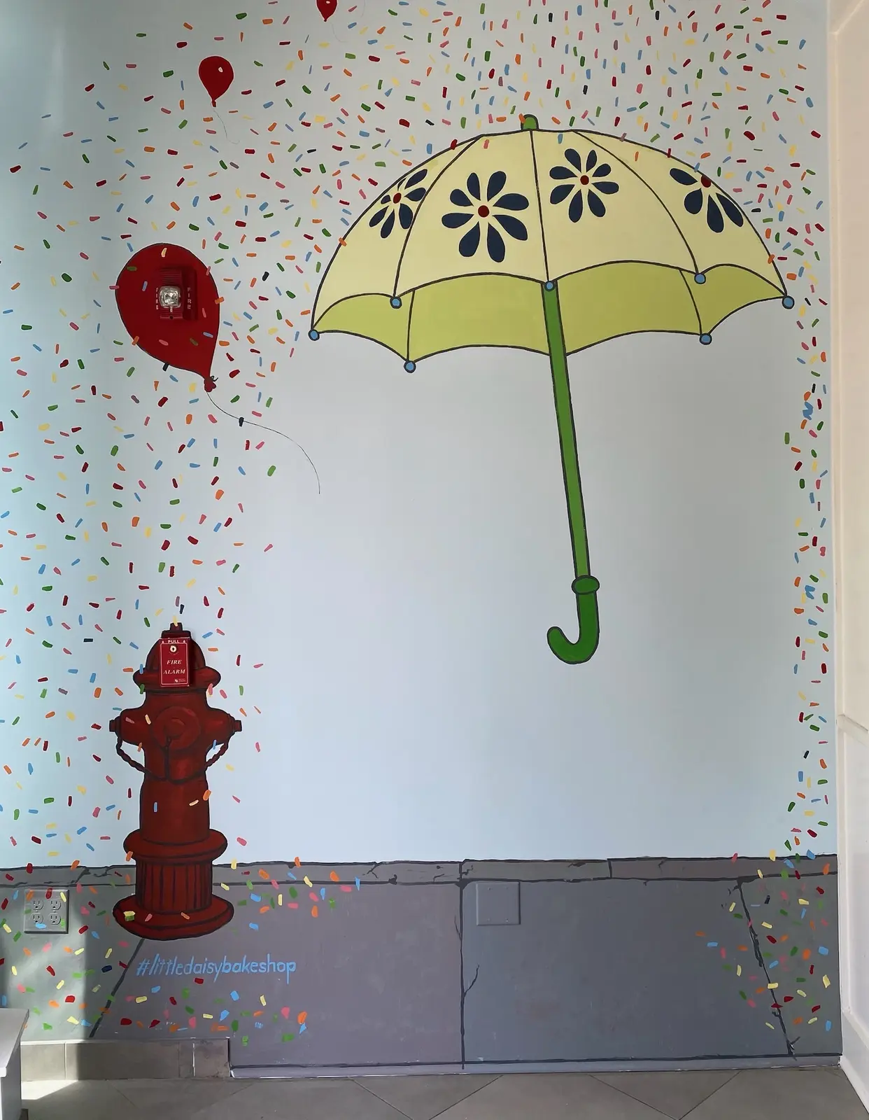 Colorful umbrella artwork at Little Daisy